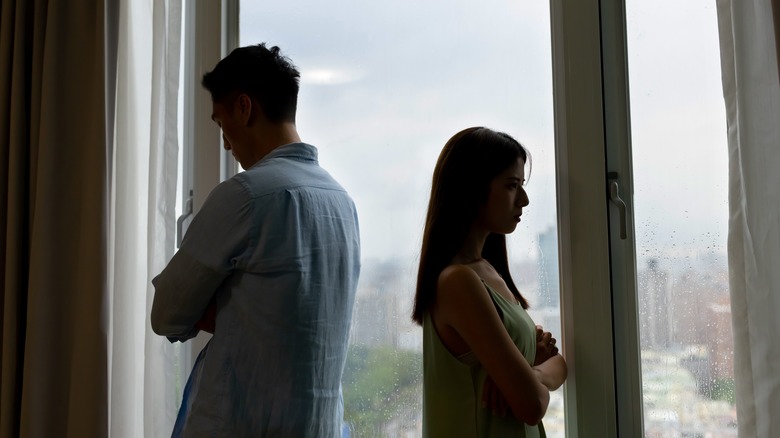 Couple back to back unhappy