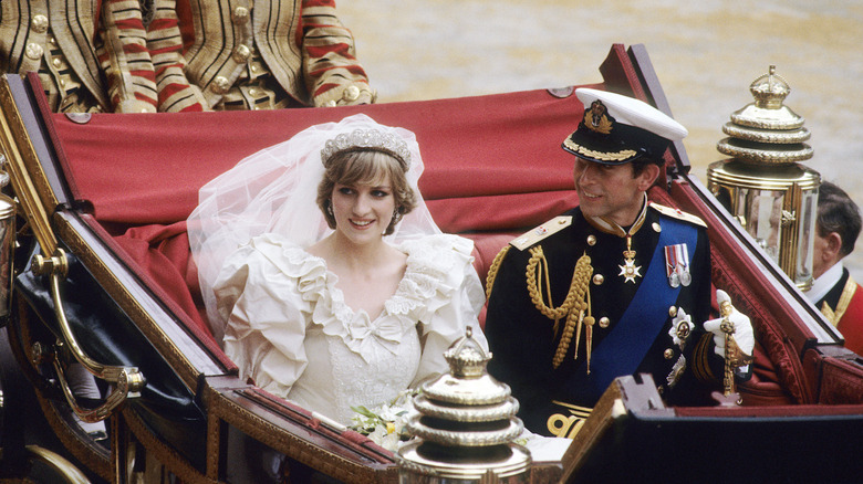 Princess Diana and Prince Charles riding in a carriage on their wedding day