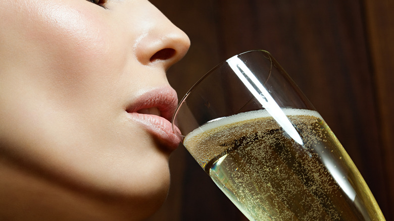 female drinking wine