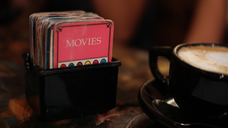 cup of coffee and trivia cards