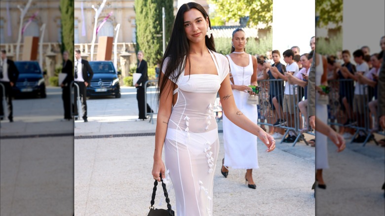 Dua Lipa walks in a sheer white gown at Simon Porte Jacquemus' wedding