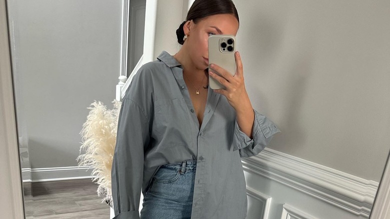 woman wearing dusty blue top