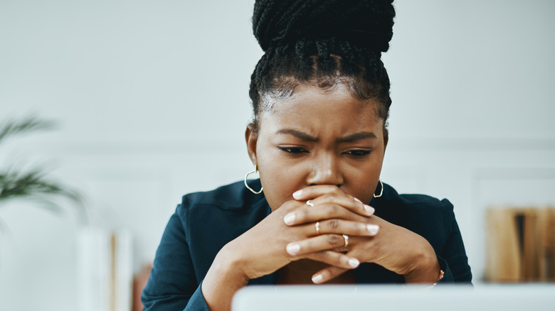 stressed woman frowning