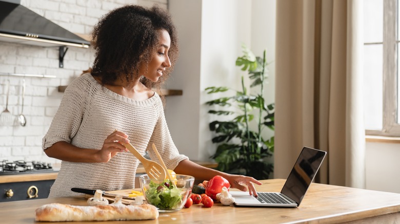 woman following healthy food recipe