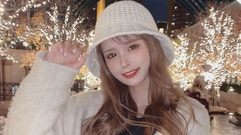 Girl poses in knit hat 