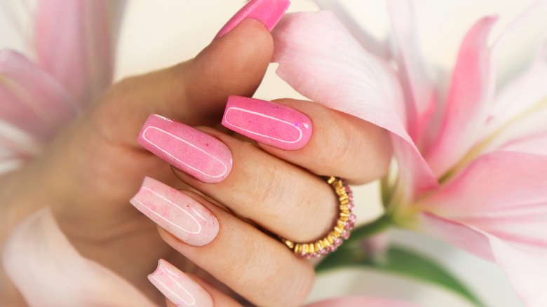 Pink manicured nails