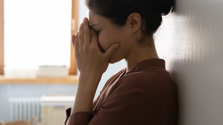 Woman appearing upset