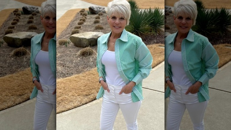 Green top and white jeans