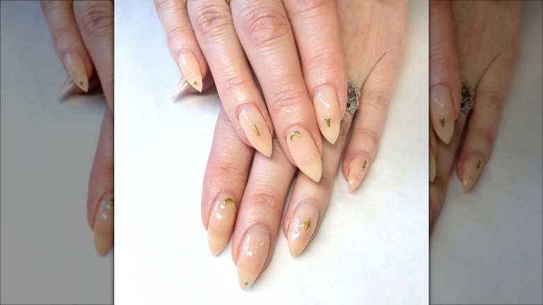 Neutral beige nails with golden details