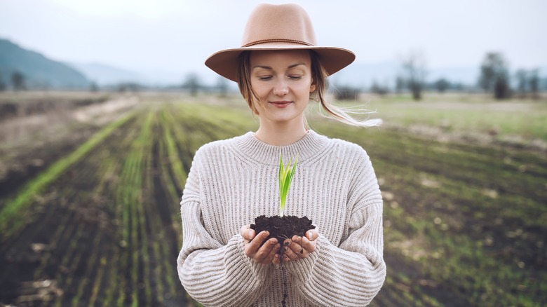 Woman holding a plant