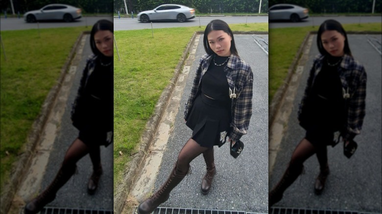 A woman wearing a plaid shirt