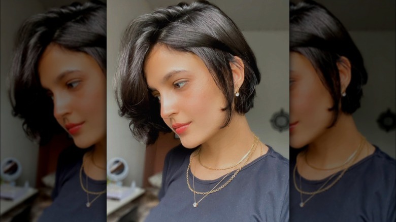 A deep side part cub haircut