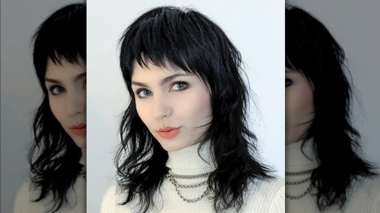 Black hair medium wolf cut short bangs