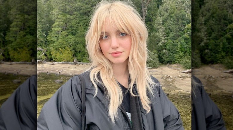 Medium wolf cut on long blonde hair