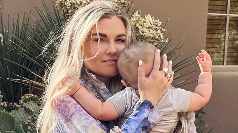 Erika Kirk holding a baby