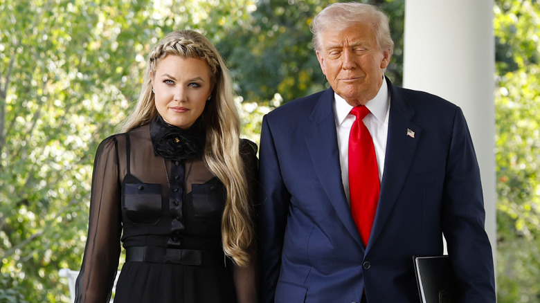 Erika Kirk walks with Donald Trump
