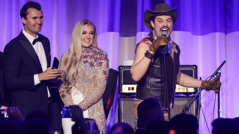 Charlie Kirk, Erika Kirk, and singer Sergio on stage at the 2025 Inauguration Eve Ball