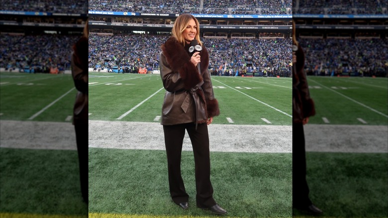 Erin Andrews on the sideline of the field reporting at a game