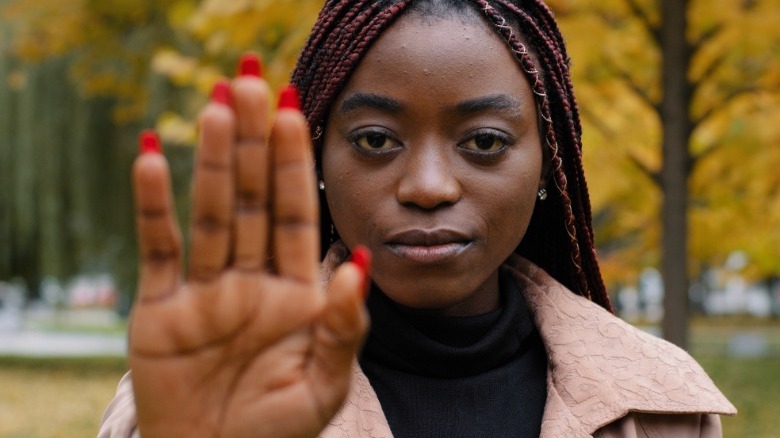 Woman holding up her hand