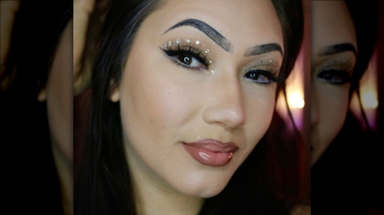 person wearing crystal eyeliner