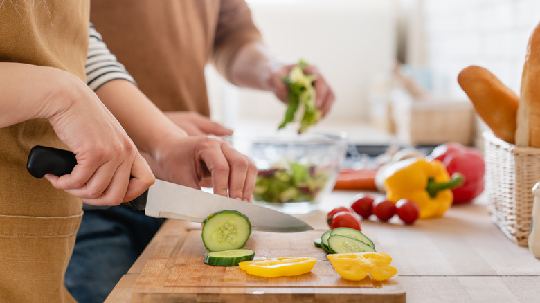 people chopping vegetables
