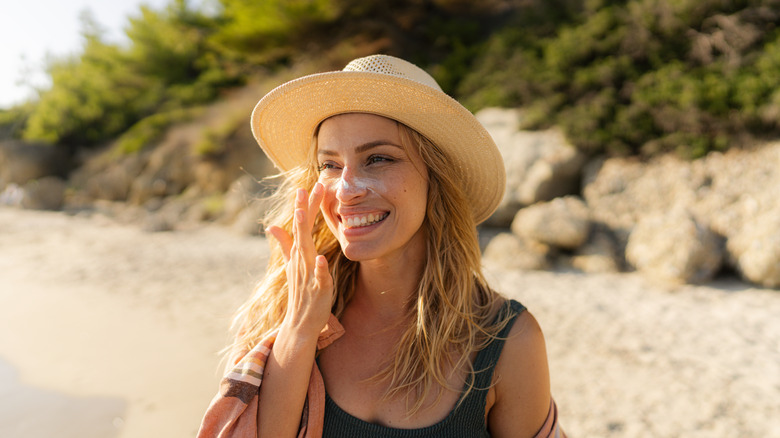 A woman applying SPF