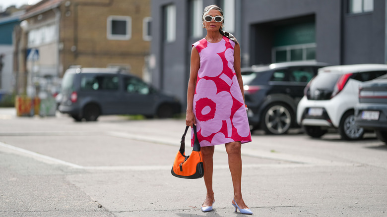 Woman wearing a floral mod shift dress at Copenhagen Fashion Week 2025