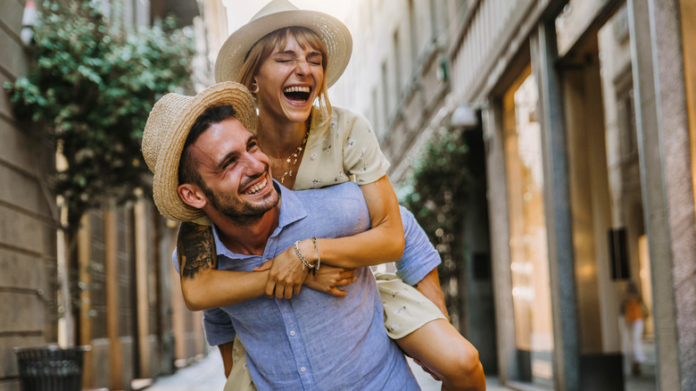 couple doing a piggy back ride