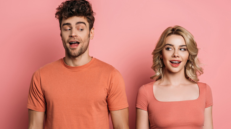 couple wearing matching orange T-shirts