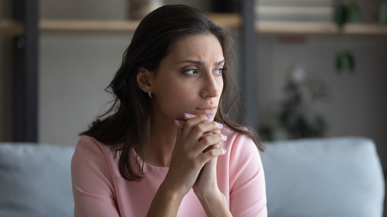 woman looking concerned and sad