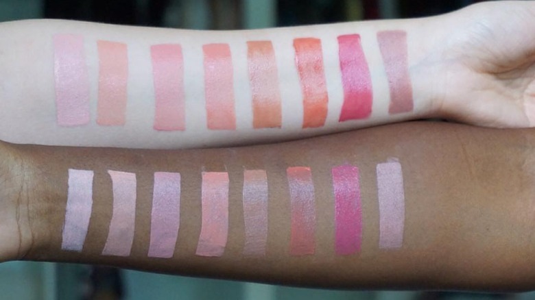 Two arms with makeup swatches