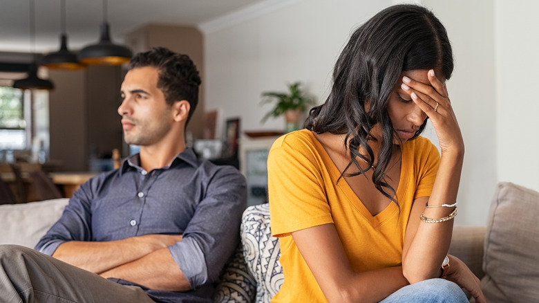 Unhappy couple ignoring one another