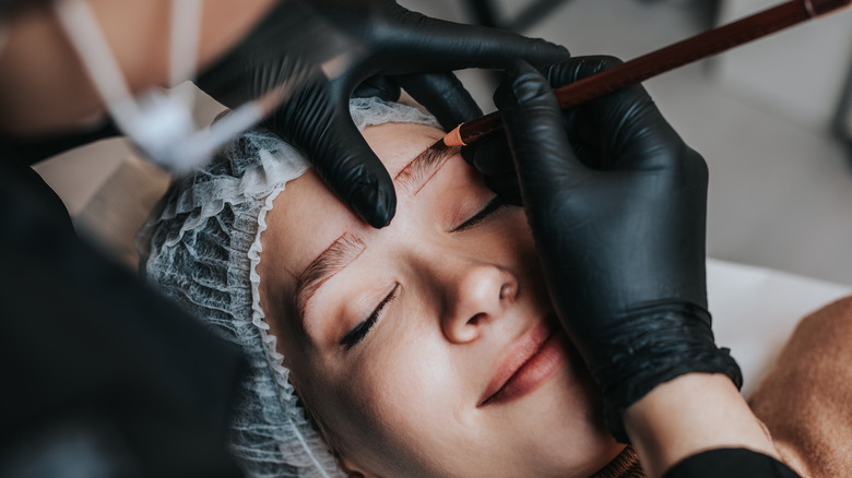 A woman getting microblading