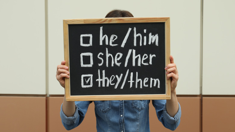 Pronouns listed on chalkboard