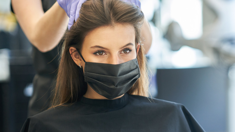 Woman getting hair done