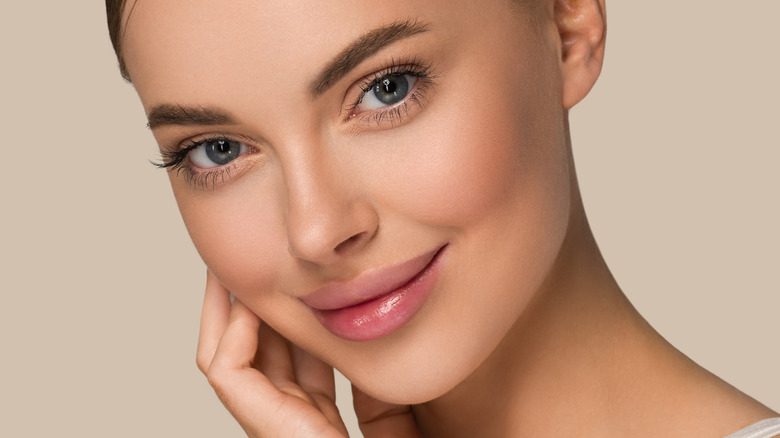 A smiling woman with healthy skin