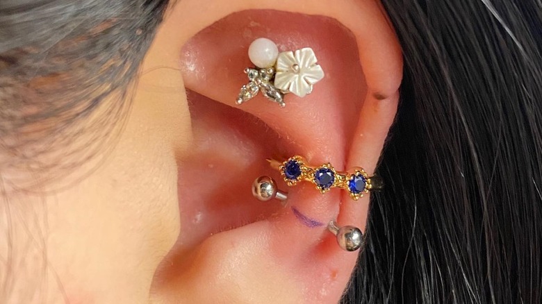 flat, outer conch, and snug piercings
