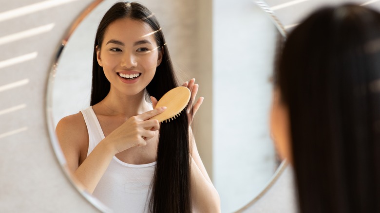 Woman brushing her long hair
