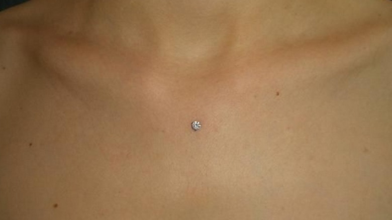 Dermal piercing on sternum 