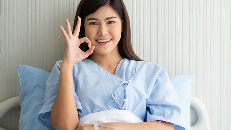 Woman in a hospital gown