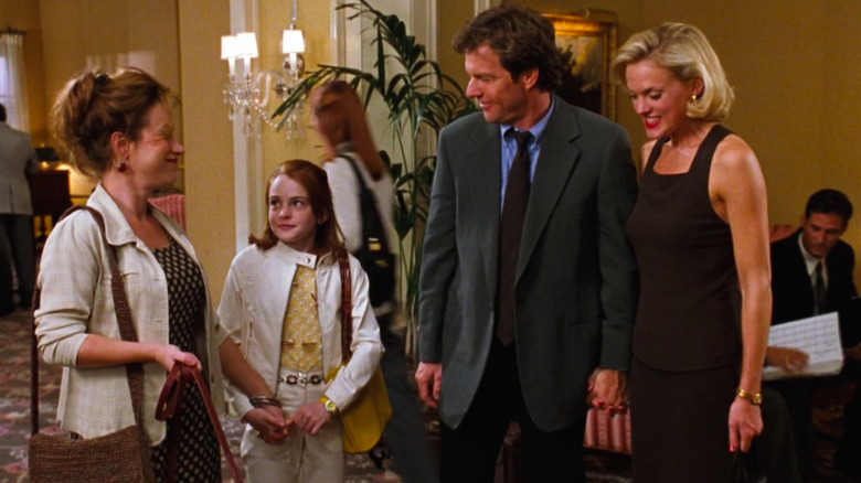 Meredith Blake in black dress