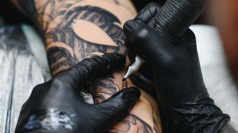 Person getting tattoo