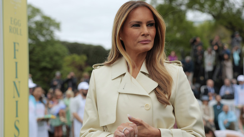 Melania Trump dressed in a cream coat at the White House Easter Egg Roll