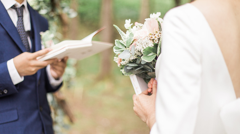 couple with vow books 