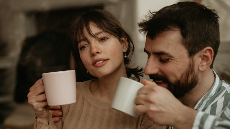 Woman smiling politely to partner