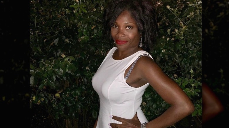 Woman posing with spiked bra strap