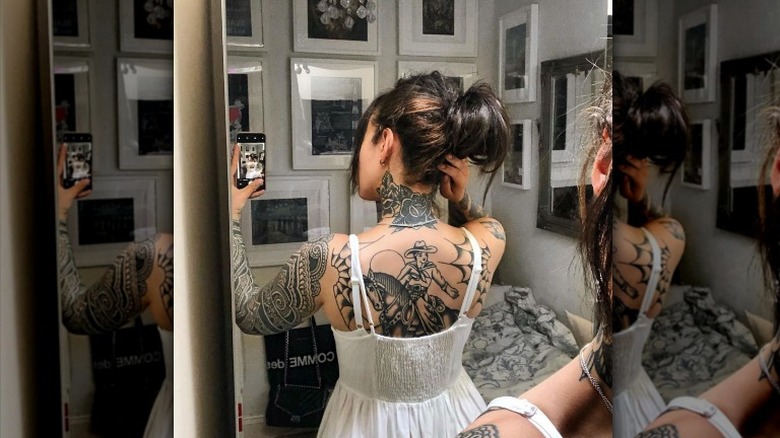 Selfie of woman with exposed bra