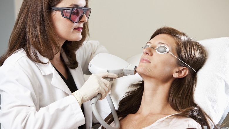 Woman receiving laser hair removal