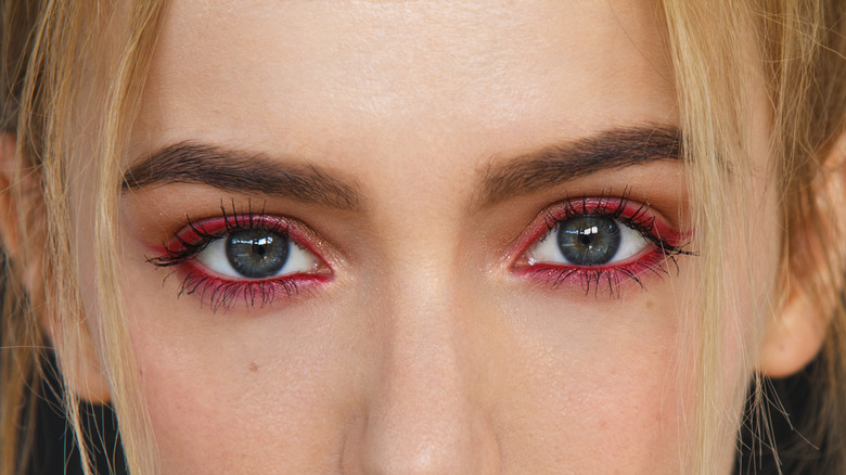 green eyes with burgundy eyeliner