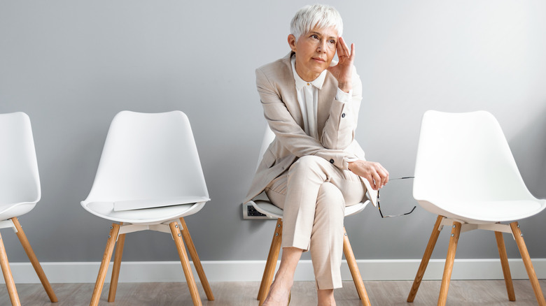 Woman sitting with legs crossed